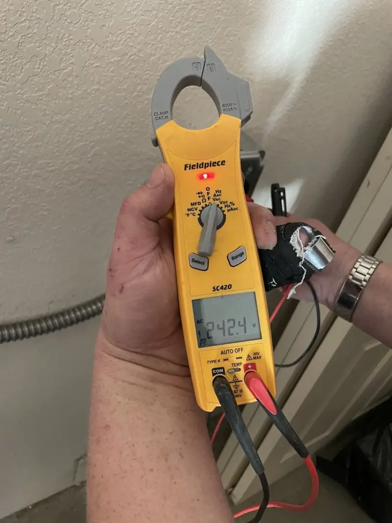 Voltage testing with clamp meter during Aluminum Wiring Replacement in Owosso